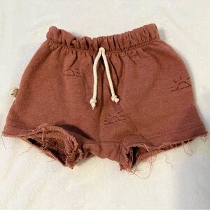 Toddler rust colored shorts with sun design